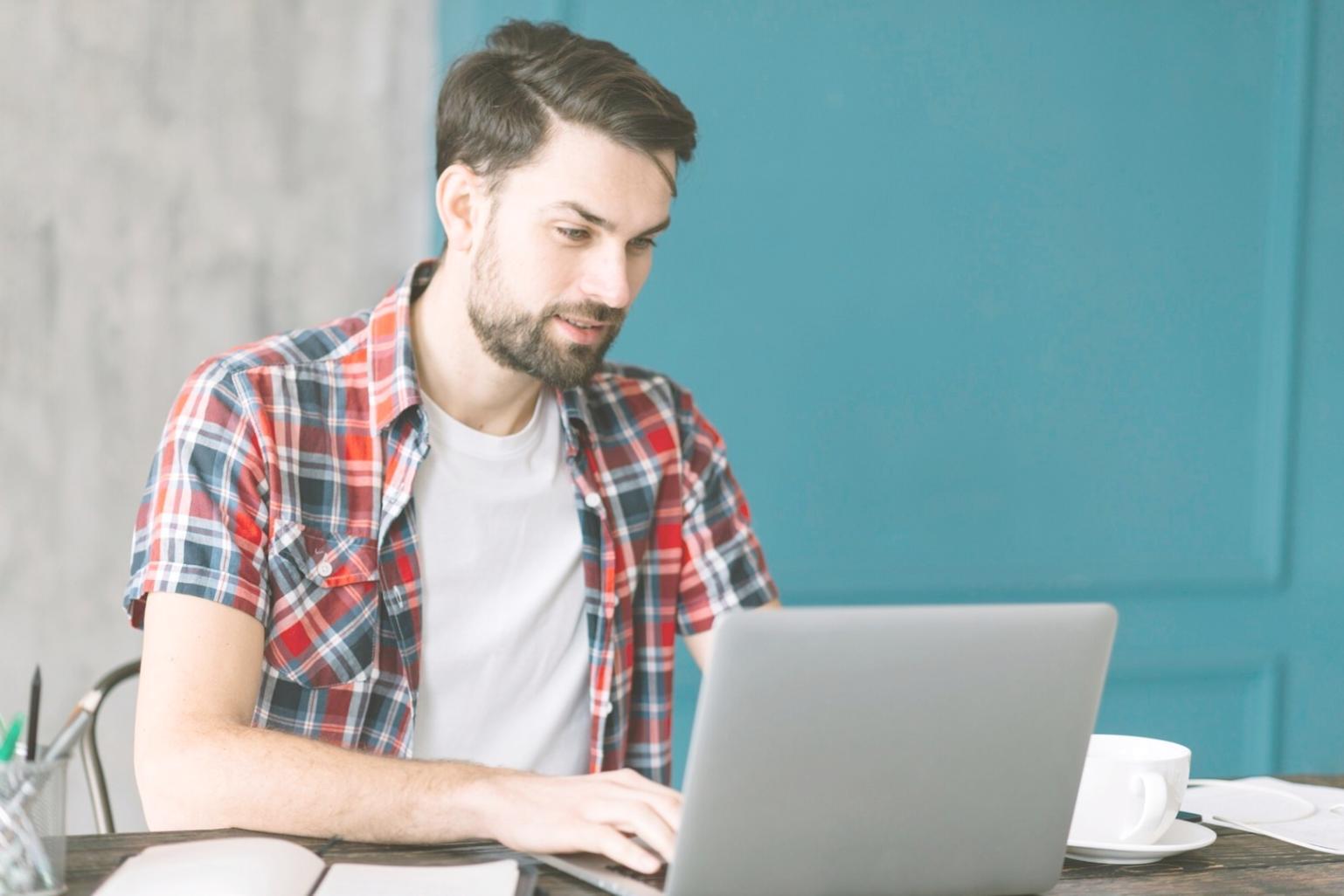 Designer reviewing mobile app interface on multiple devices